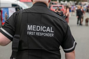 Back view of a man in a uniform that says "Medical First Responder"