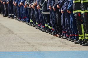 A close up of a line of first responders.