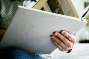 Close up of someone holding a memory book.