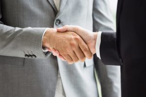 Close up of two men shaking hands