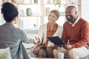 Husband and wife sitting at home with an estate planning attorney