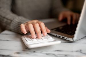 A person using a calculator
