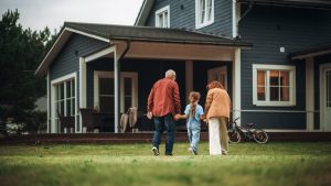 Grandparents walking with their grandchild outside